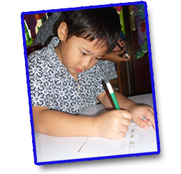 Kindergarden kids writing